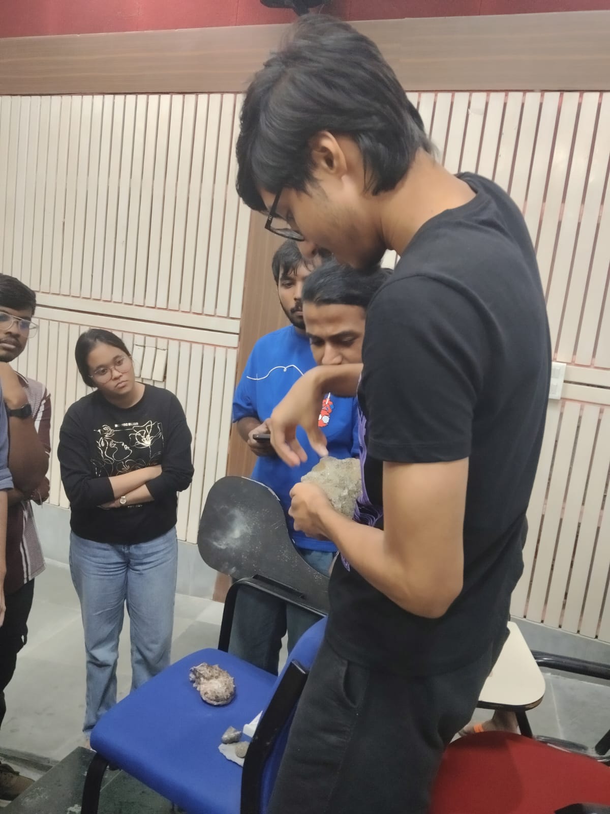 Students examining a geological sample